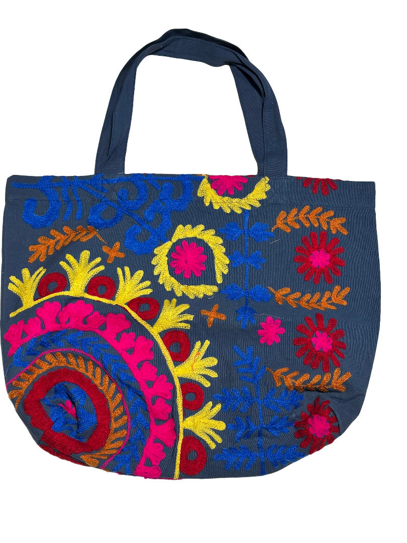 Suzani canvas beach bag with embroidery in navy blue, pink, yellow and green, front view