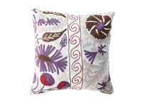 Unique suzani pillowcase 50x50 cm in light white with colorful purple and brown floral motifs and red ornamental border in oriental boho vintage style